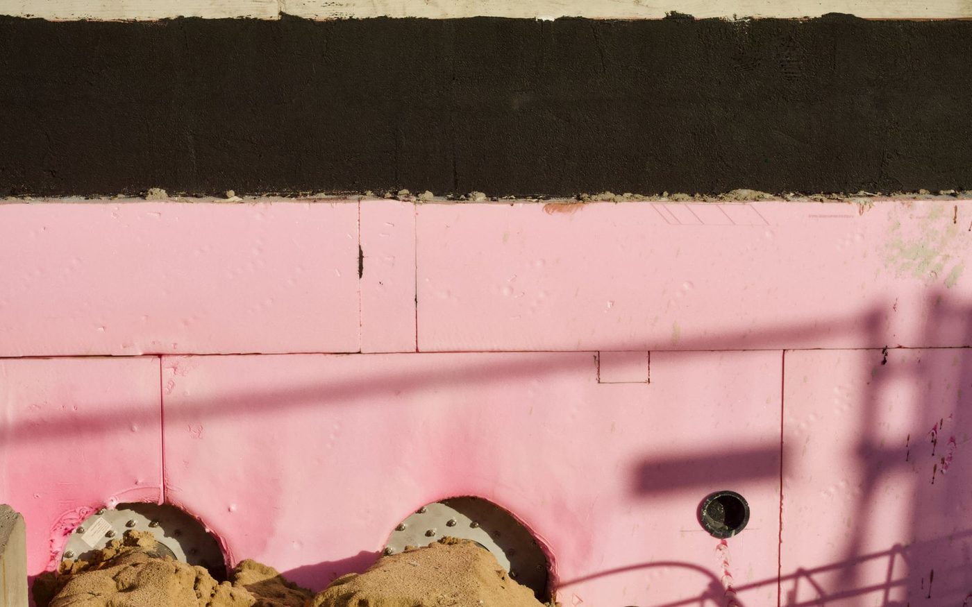Pink insulation board on a building site