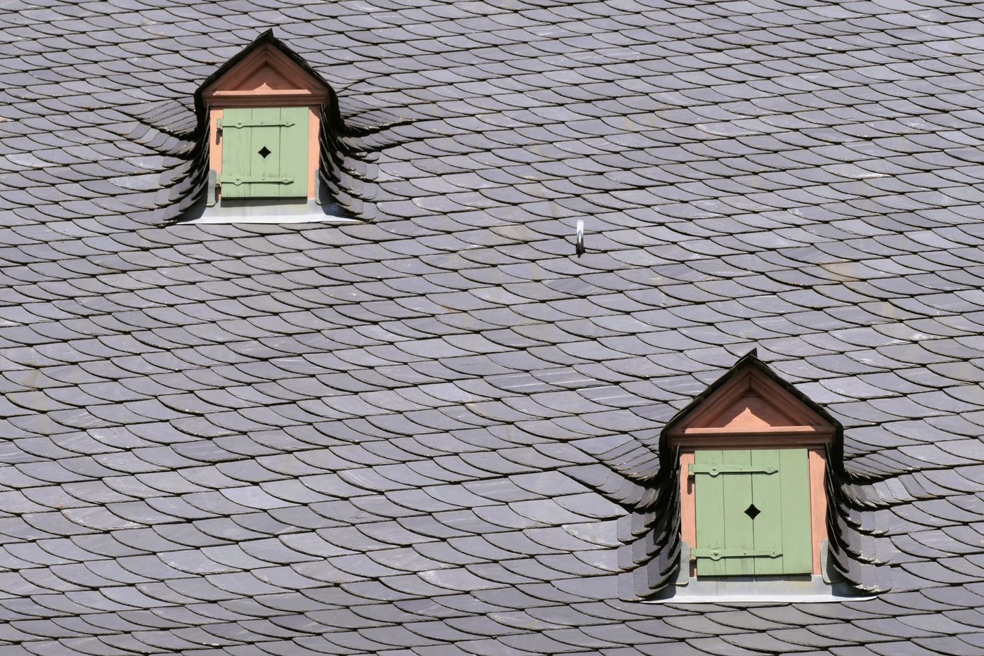 Slate roof with shuttered dormer windows