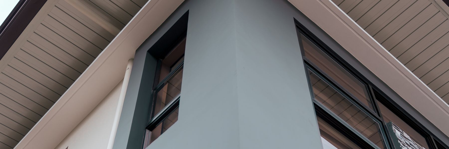 Gable and white soffit of a house, seen from below
