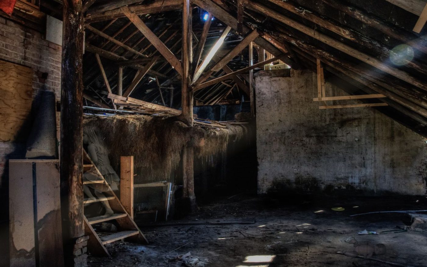 Dim attic with exposed wooden rafters