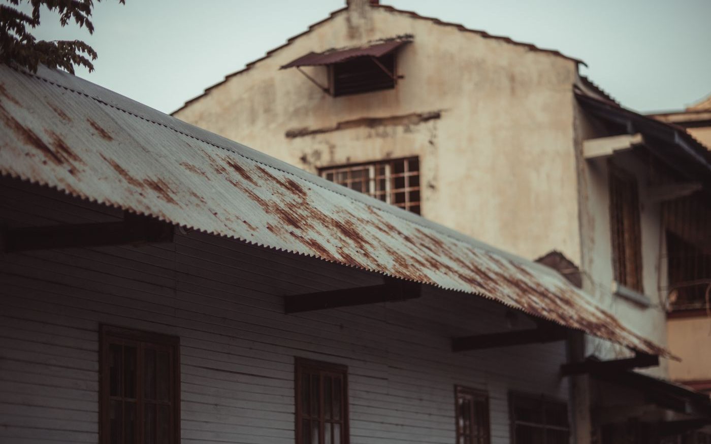 Aged building with a rusted corrugated roof