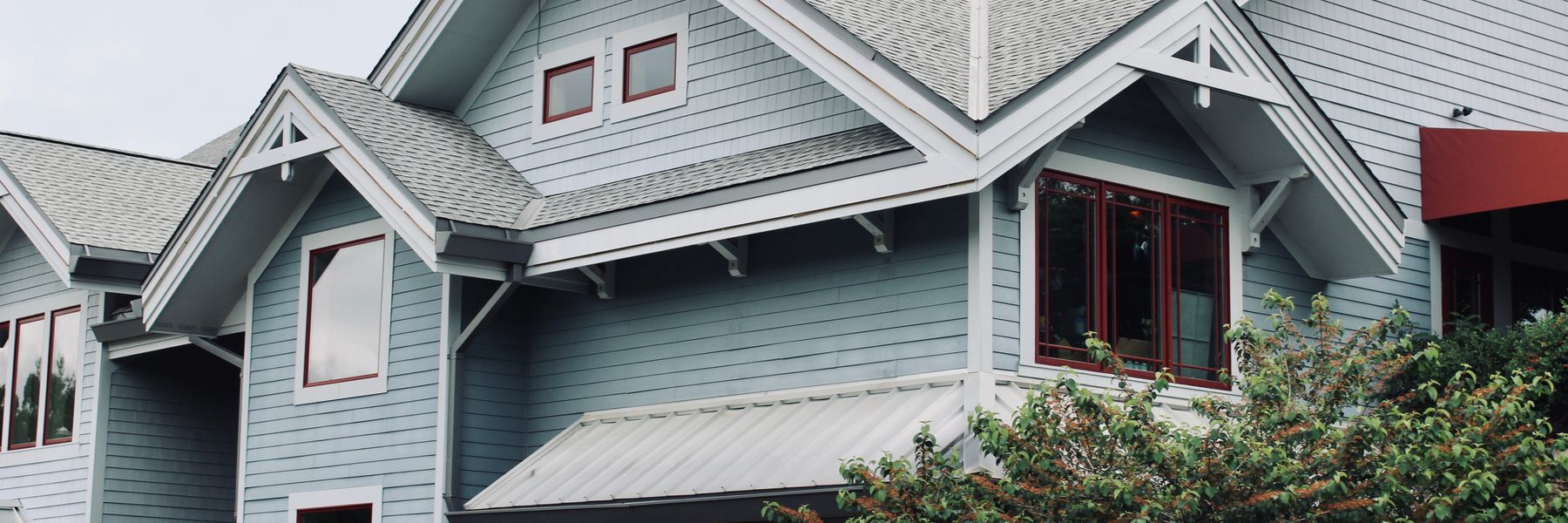 Gray-blue two story house with white trim