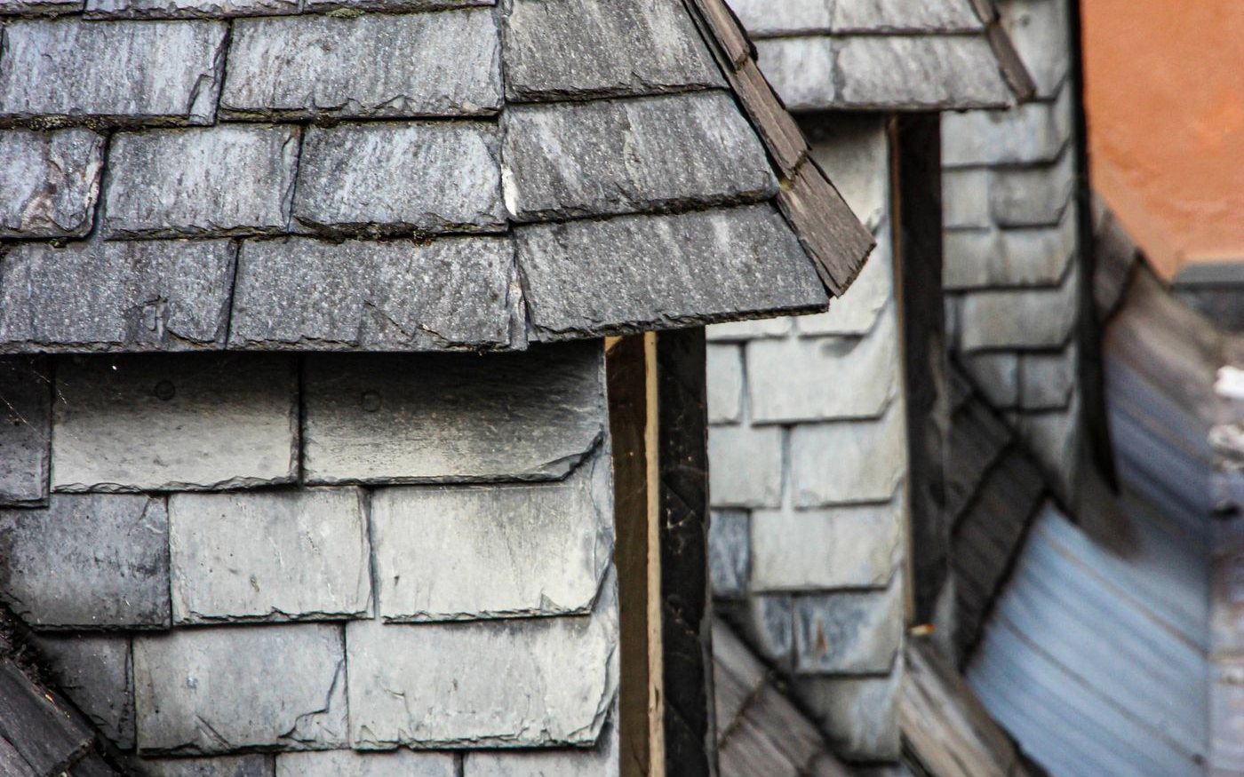 Slate rooftops and dormers set close together